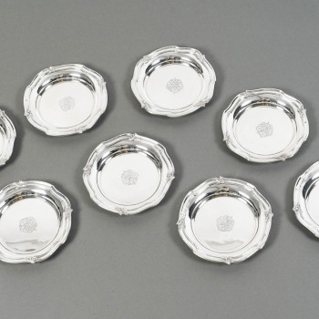 ORFEVRE HENIN - Suite of eight solid silver bottle coasters from the 20th century