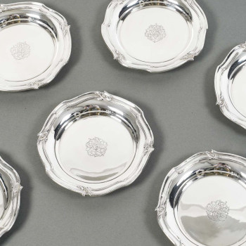 ORFEVRE HENIN - Suite of eight solid silver bottle coasters from the 20th century