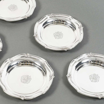 ORFEVRE HENIN - Suite of eight solid silver bottle coasters from the 20th century