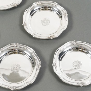 ORFEVRE HENIN - Suite of eight solid silver bottle coasters from the 20th century