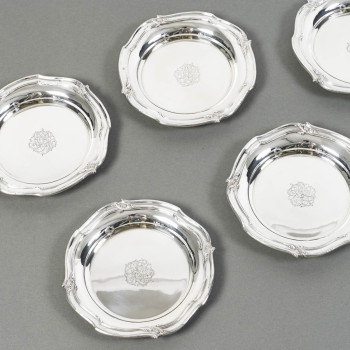 ORFEVRE HENIN - Suite of eight solid silver bottle coasters from the 20th century